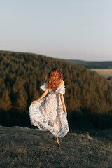 Beautiful bride in nature in boho style. Wedding in the European style of fineart at sunset.