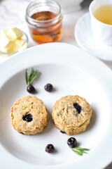 Blueberry scones. a Traditional British baked good for tea time. set on cafe table.