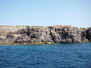 Fototapeta na wymiar Sardinia Along the cliffs of the island of San Pietro, cavities and sea caves