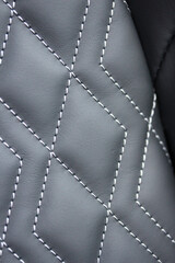Diamond-pattern stitching on black leather