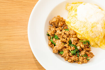 stir-fried pork and basil with creamy omelet on rice