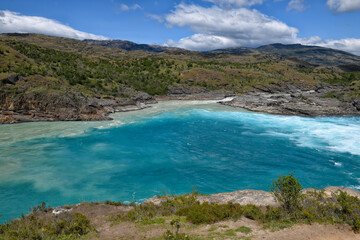 Rapids at the confluence of blue Baker river and grey Neff river, Pan-American Highway between...