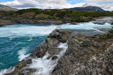 Rapids at the confluence of blue Baker river and grey Neff river, Pan-American Highway between...