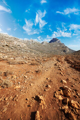 Landscpae of rocky red Desert over blue sky