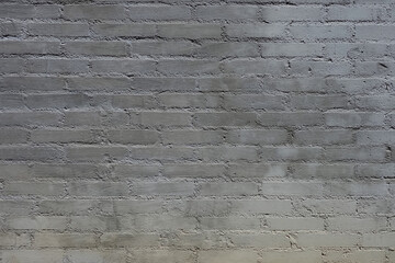 gray brick stone background in the building wall