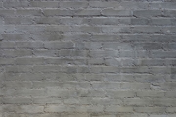 gray brick stone background in the building wall