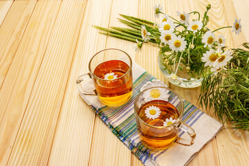 Chamomile tea. Fresh flowers, summer hot drink concept. Alternative medicine, lifestyle