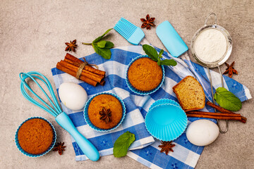 Homemade cupcakes with cinnamon, star anise and fresh mint. Bakery concept, set of ingredients for...