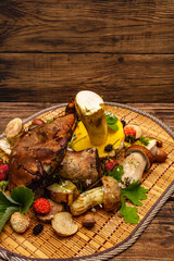 Fresh forest mushrooms. Assorted gourmet porcini and boletus, oak leaves, strawberries
