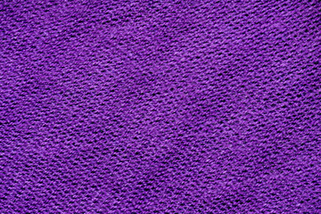 Purple knitted cotton fabric texture background.