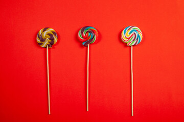 three lollipops on red backgrounds
