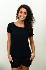 Portrait of happy young beautiful Hispanic woman