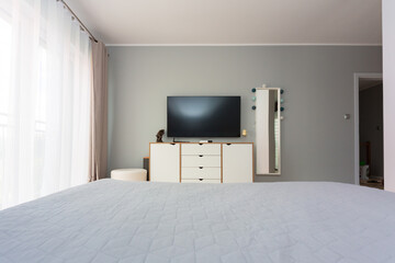 Master bedroom in gray and white colors