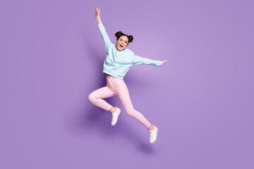 Fototapeta na wymiar Full length body size view of nice attractive lovely slim ecstatic cheerful glad girl jumping having fun fooling isolated on violet purple lilac bright vivid shine vibrant color background