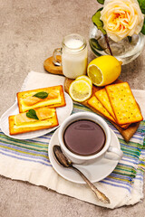 Healthy breakfast. Cup of coffee (black tea), milk, crackers with butter and salmon