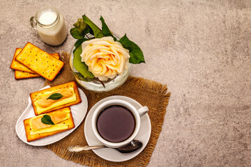 Healthy breakfast. Cup of coffee (black tea), milk, crackers with butter and salmon