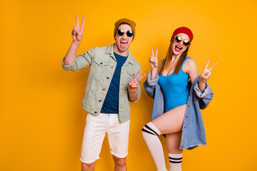 Photo of attractive crazy lady guy young husband wife tourists spend vacation together show v-sign...