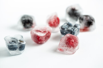 ice cube with raspberry and blueberry