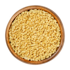 Soya granules in wooden bowl. Textured soy protein, also called soy meat. Defatted soy flour...