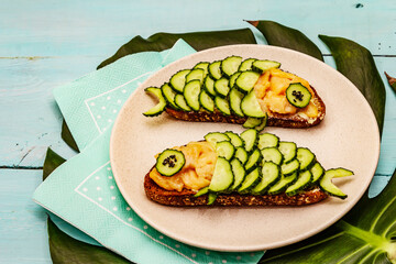 Funny salmon sandwiches with cucumber for kids