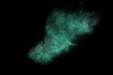 Aquamarine powder explosion on black background. Colored powder cloud. Colorful dust explode. Paint  Holi.