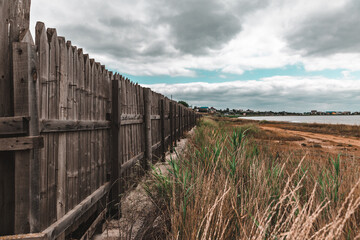 Fototapeta premium wooden fence on the beach