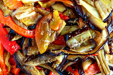 Grilled eggplants and sweet red peppers appetizer. Healthy eating, seasonal colorful vegetables concept. Top view