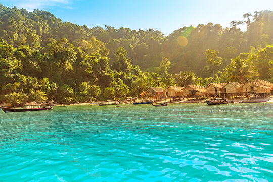 Fisherman village landscape of Ko Surin Marine National Park. Traditional long-tail boats and houses of Moken tribe Village or Sea Gypsies and tropical waters of Surin Islands in Thailand, Phang Nga.