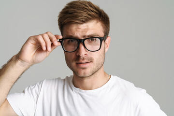 Portrait of handsome confident man posing and looking at camera