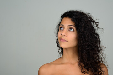 Portrait of young beautiful Hispanic woman shirtless