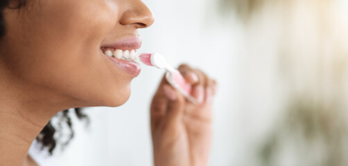 Oral Hygiene. Closeup Of Black Woman Brushing Her Perfect White Teeth