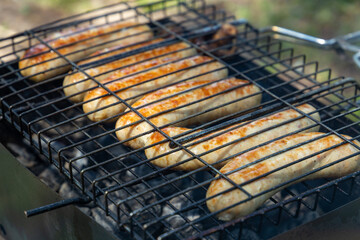 barbecue grill sausages close up. Dinner on the nature.