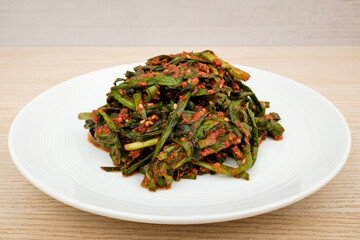 Leek kimchi on white background