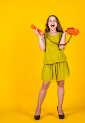vintage technology in modern life. kid using mobile device. everyday connection and communication. digital technology in future. world wide network. child hold retro phone