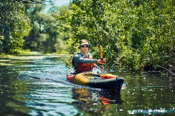 Happy best friends having fun on a kayaks. Kayaking on the river.