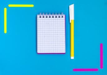 Office supplies on a blue background. Back to school concept. Display of products for creativity and learning.Text frame with school supplies. layout of the school. Flat lay. copy space.