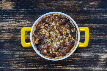 Homemade organic currant pie with walnut, dessert ready to eat. Currant tart on the old wooden background, closeup