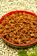 Love vegan and vegetarian food concept, plant based minced meat in plate on soya beans background