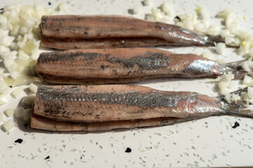 Season of new Dutch herring fresh salted fish ready to eat, traditional food in Netherlands