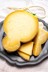 Italian semi hard matured caciocavallo cheese, handmade and aged in natural underground caves in...