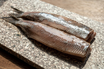 Season of new Dutch herring fresh salted fish ready to eat, traditional food in Netherlands