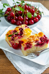 Fresh baked cake with red ripe juicy sour cherry or kriek berry