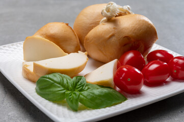 Italian semi hard handmade smoked scamorza cheese, from cow milk from Apulia or Calabria regions