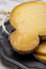 Italian semi hard matured caciocavallo cheese, handmade and aged in natural underground caves in...