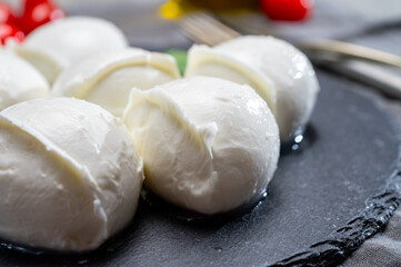 Tasty italian food, fresh white buffalo mozzarella soft cheese balls from Campania