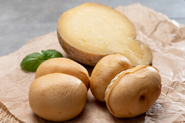 Italian semi hard handmade smoked scamorza and caciocavallo matured in caves cheeses made from cow milk from Apulia or Calabria regions