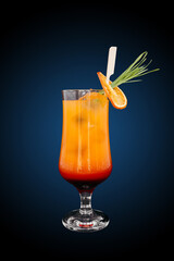 Tequila sunrise Cocktail isolated on a blue gradient