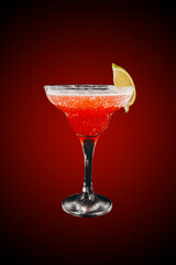 Margarita cocktail with lime isolated on red gradient 