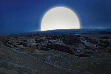 full moon over the ruins  of an ancient Parthian fortress in the desert at night