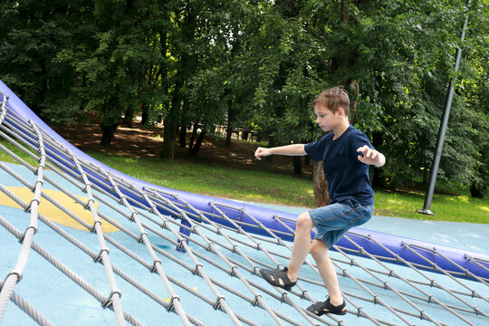 Kid training over obstacle course